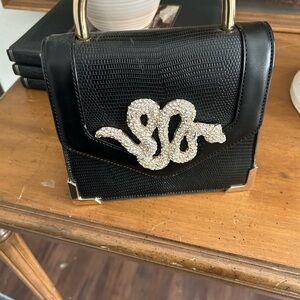 Elegant Black Handbag with Gold Accents